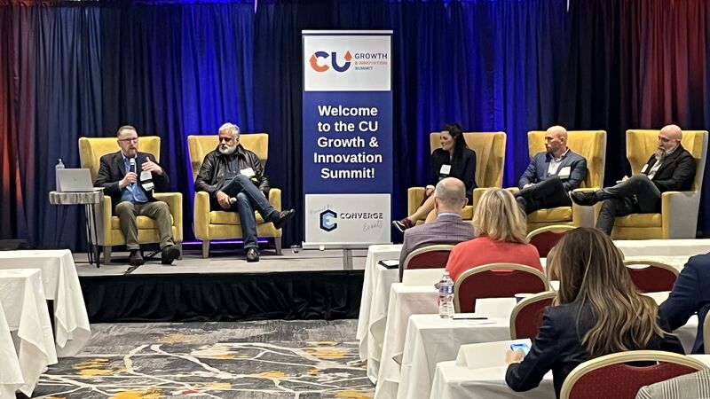 Executives speaking during a panel on credit union innovation