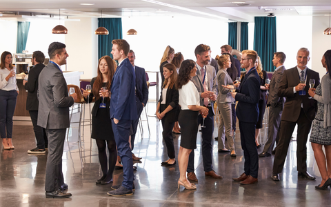 Attendees networking during the opening night cocktail reception at CU Growth Summit